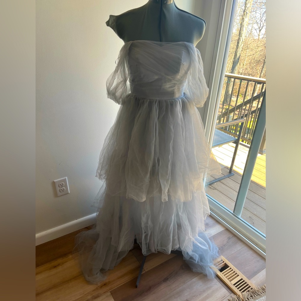Light grey strapless ruffle tulle prom dress slit in front.